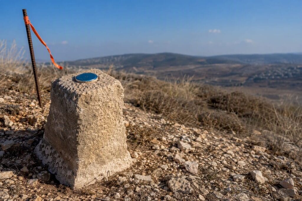 Israeli parcel boundary marker in Mediterranean landscape