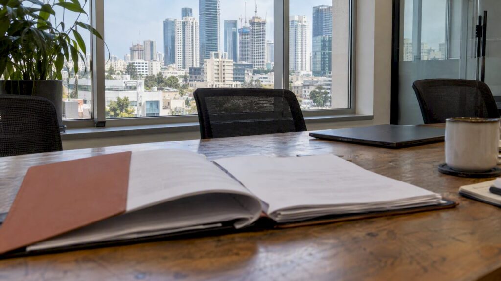 Israeli investment agreements in a Tel Aviv office