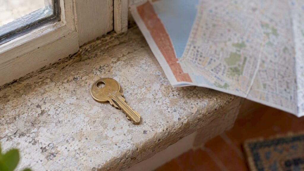 House key beside an Israeli property map
